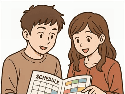 スケジュール帳を一緒に見ている笑顔の男女